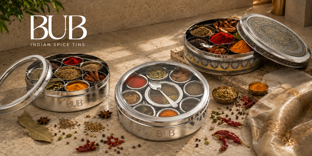 BUB Indian spice tin collection with stainless steel masala dabbas, decorative spice box, turmeric, chilli powder, cumin, cardamom and whole spices.